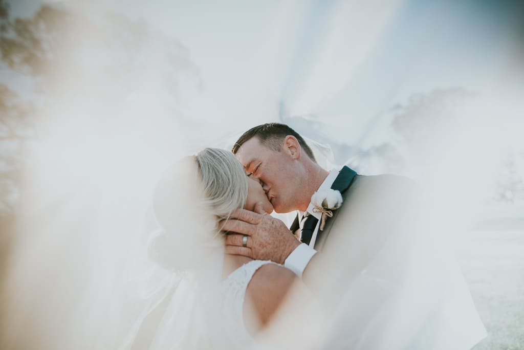 Beautiful Wedding Veil Photograph with Bride & Groom - ABIA Real Wedding
