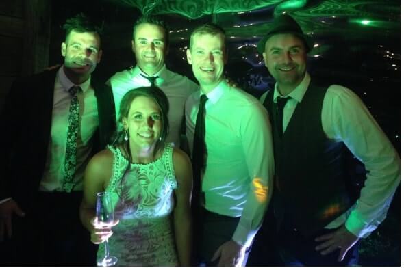 Happy couple with the 3 piece band.