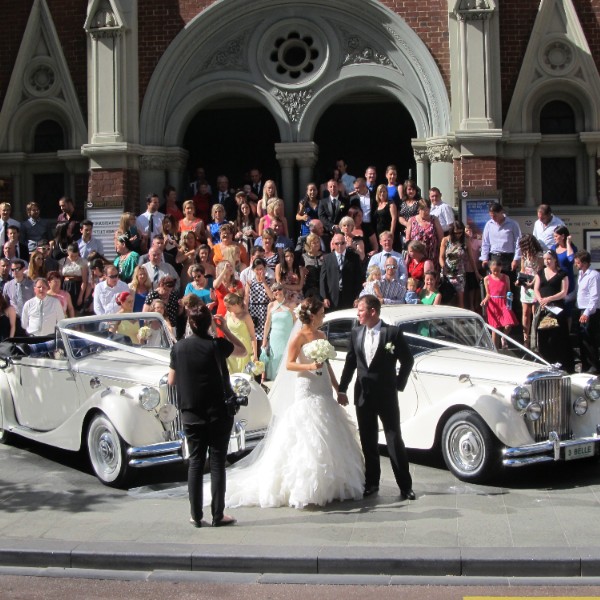 Two Jaguars in front of church