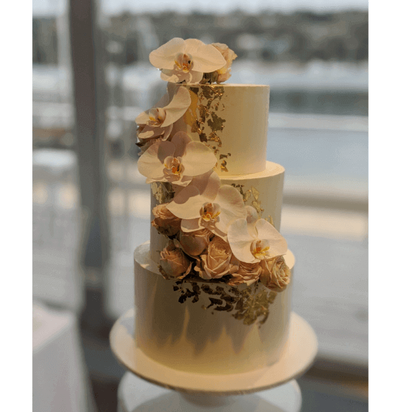 3 tier gold and pink cake