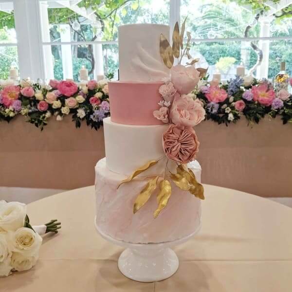 tiered fondant cake with sugar flowers