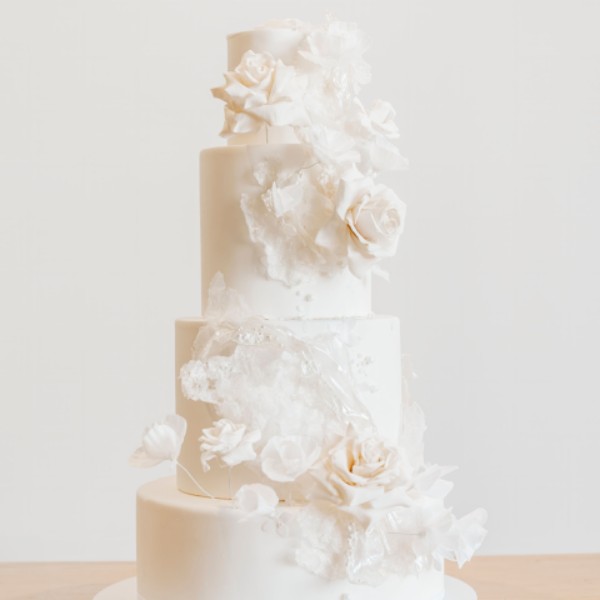 4 tier fondant cake with sugar flowers and wafer sails
