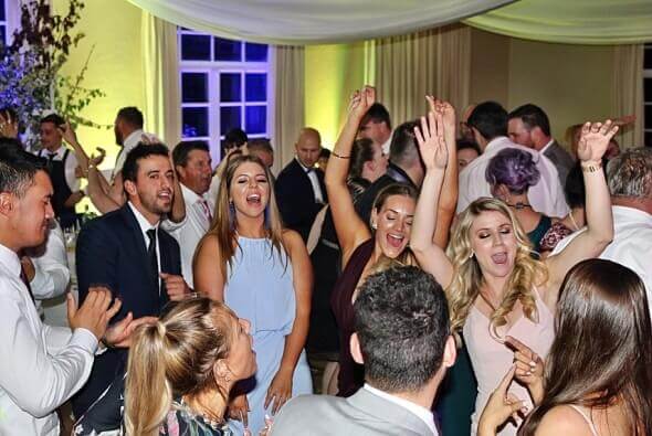 Wedding guests having the time of their lives celebrating at a DJ:Plus! Entertainment Wedding