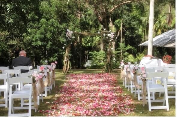 Rustic arbour and featured rose petal carpet