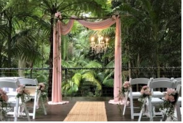 Ceremony setting with mix and match arbour style with chandelier