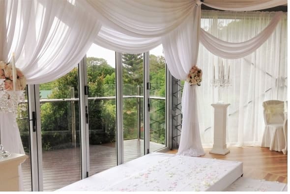 Ceremony styled with draping ,  candelabras