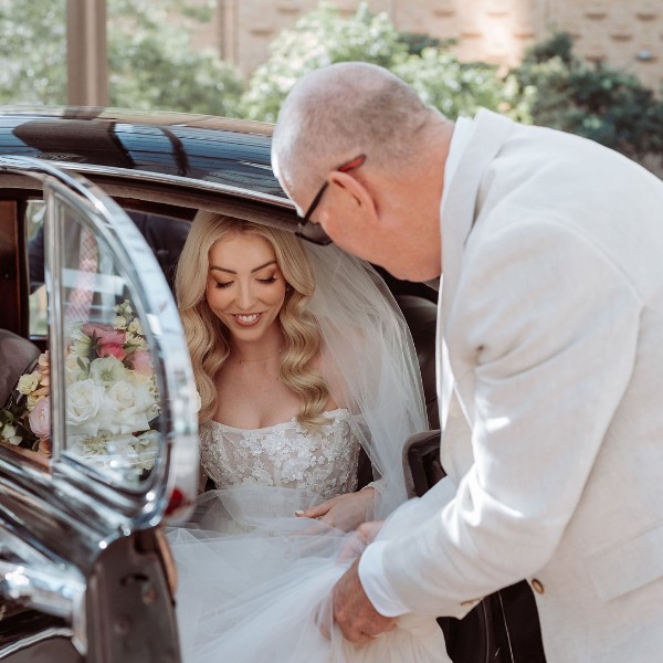 Father and Daughter moment before walking down the isle.