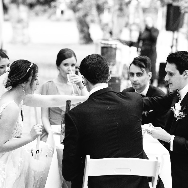 singing for the couple as they enjoy a meal