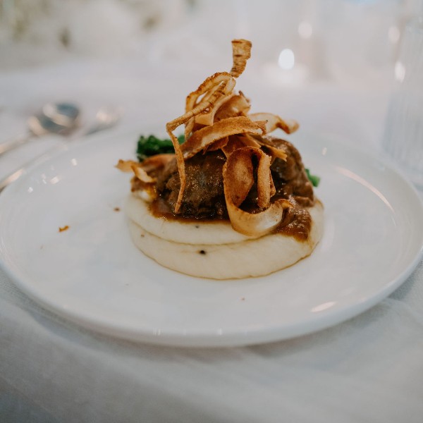 Braised Beef Cheeks w/ truffled pommes puree, broccolini, parsnip crisps & a beef & port jus. (gf)