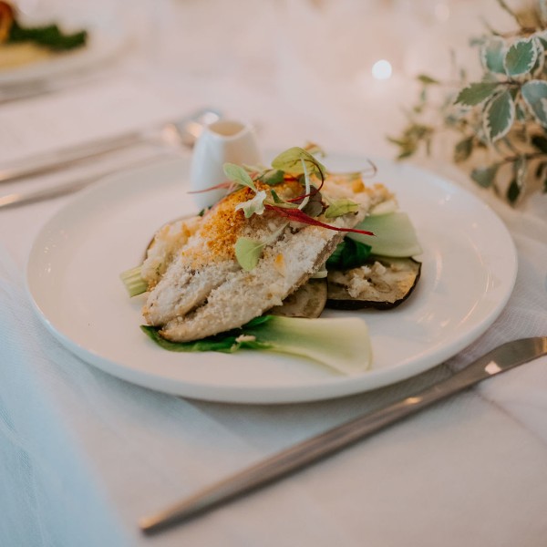 Coconut & Macadamia crusted Barramundi w/ a green curry sauce, pac choi & grilled eggplant. (gf) (df)