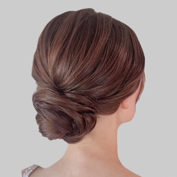 Modern texture bridal low updo hair
