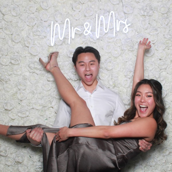 Flower wall with neon sign