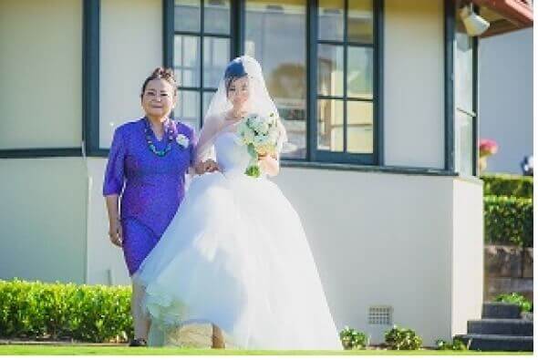 Mother walking of daughter down