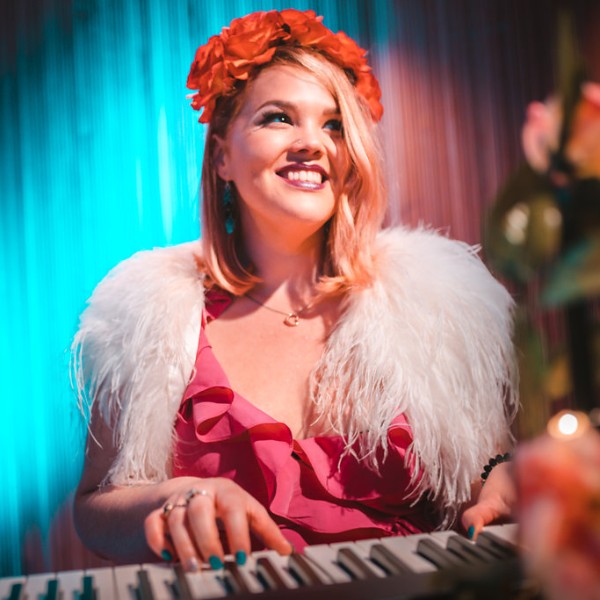 Katie Elle Jackson- serenading guests as the bride makes her entrance!