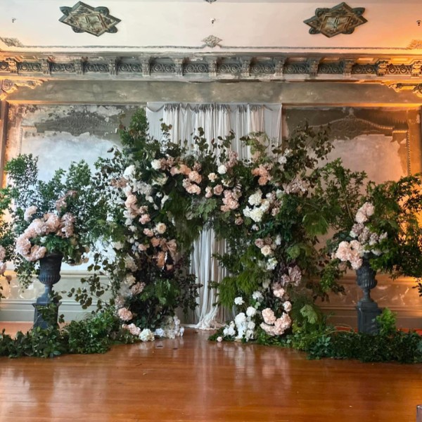 The epitome of whimsy with this gorgeous ceremony backdrop at the George Ballroom