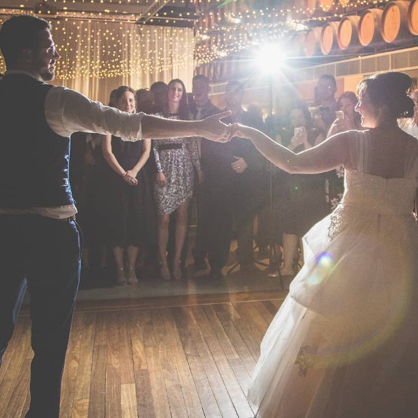 couple with lights behind