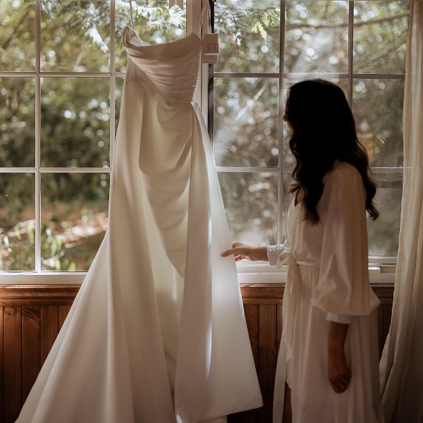 Bride checking dress on wedding day at Poet's Lane