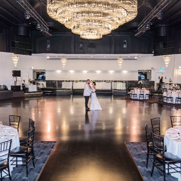 Ilana & Elio under our grand crystal chandelier
