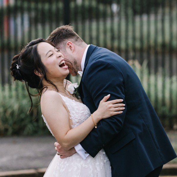 Bride and groom sharing a laugh