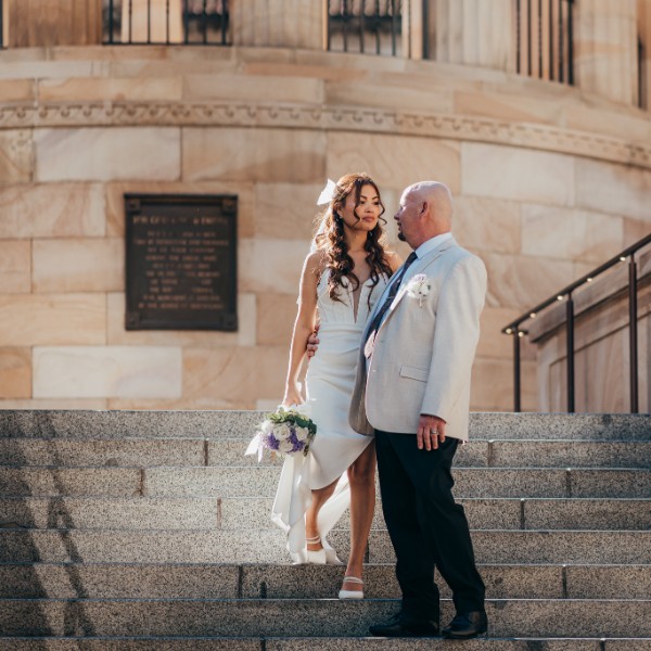 bride and groom on the steps
