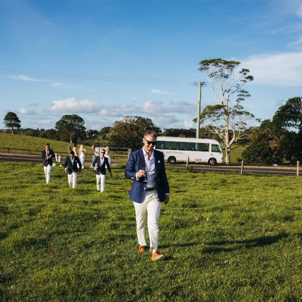 Groomsmen and bridesmaids head to an offsite location with the Photo Bus service