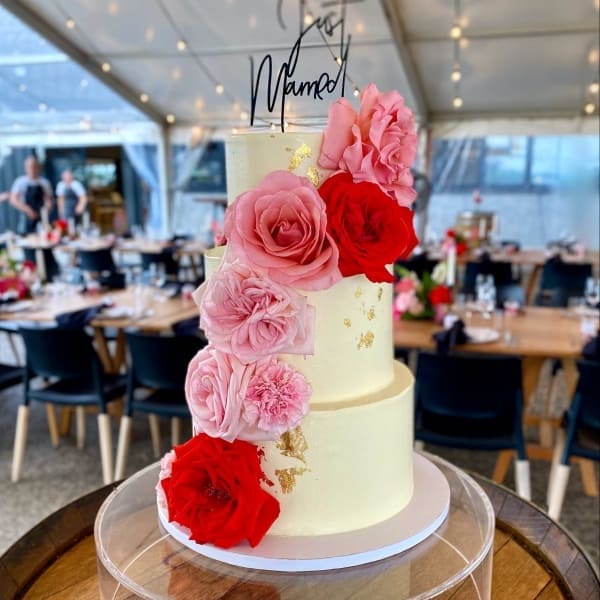 Wedding cake in white, red, pink and gold by SuperEgo Cakes
