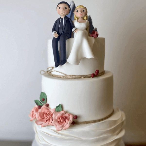 Wedding cake with fondant bride and groom by SuperEgo Cakes