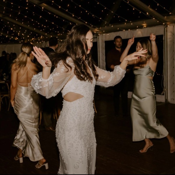 Bride and bridesmaids enjoy lively dancefloor as the Famos DJ at a wedding reception in the Gold Coast Hinterland