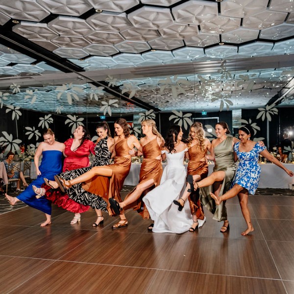 bride and bridal party dancing at reception