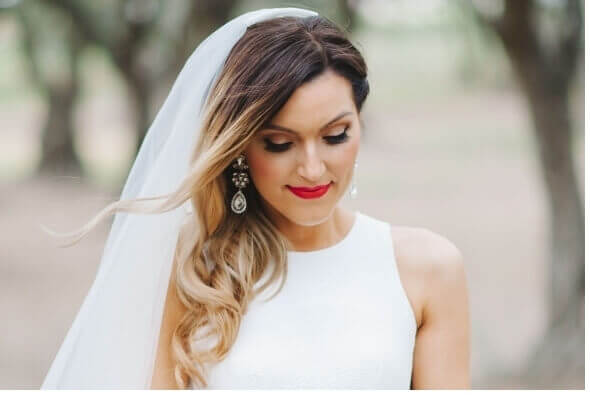 Vintahe Bride with red lip, winged liner and water wave curls