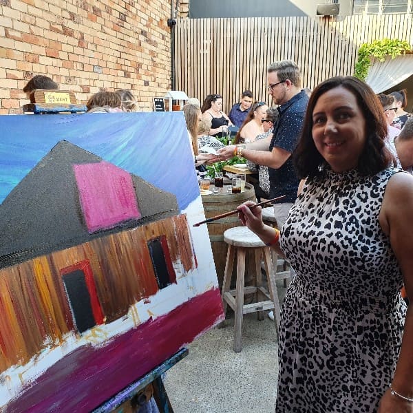 Guest adding their touch to the painting