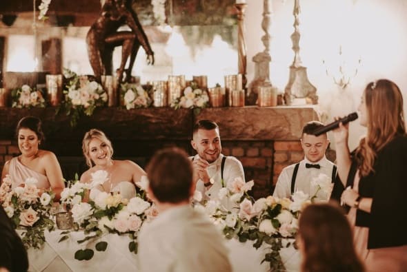 Kate MCing as a happy couple are entertained