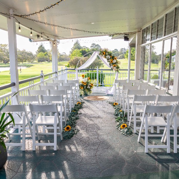 Intimate balcony ceremony overlook the lake and greens